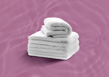 stack of towels in purple background